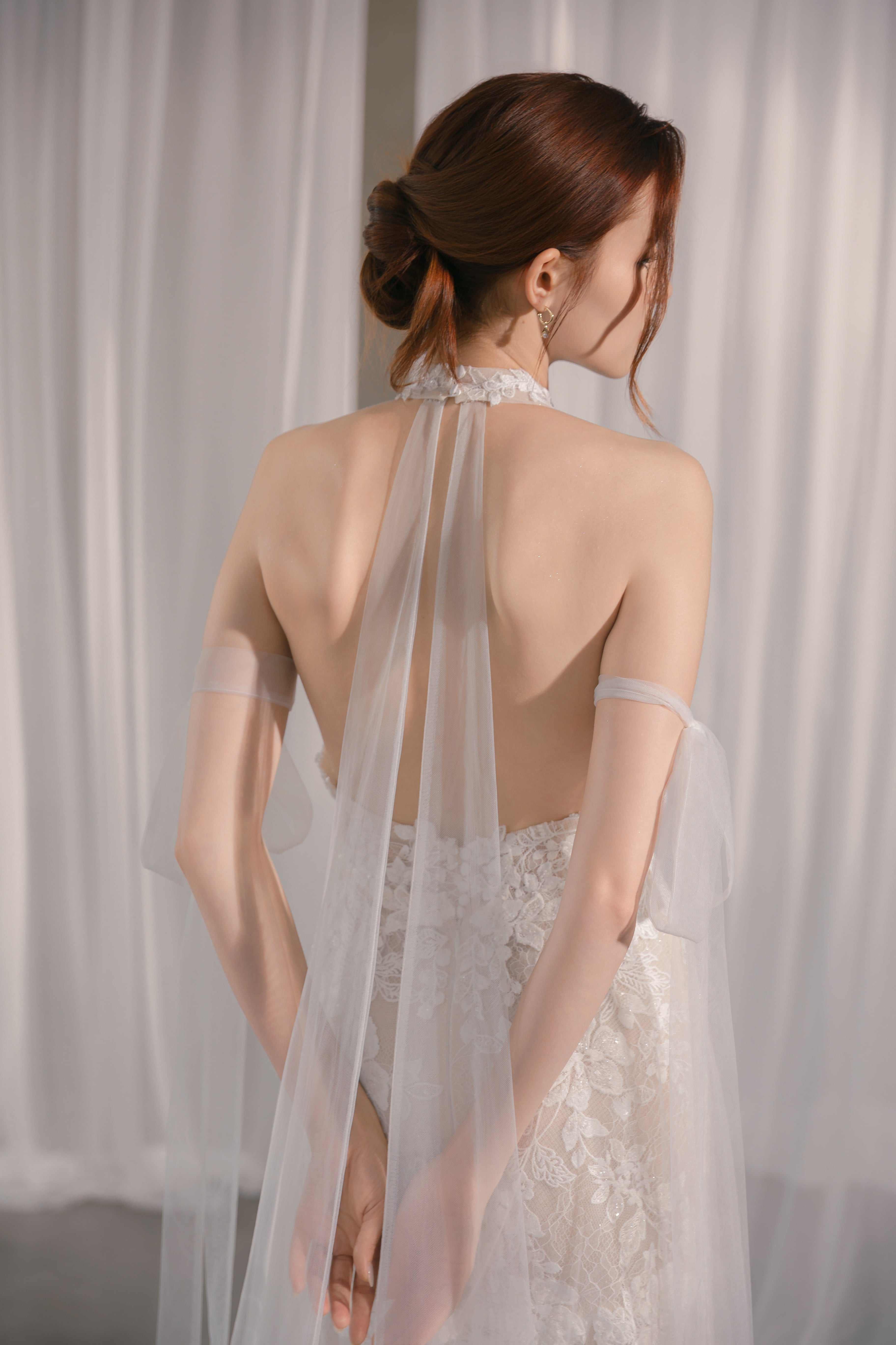 Halter-neck wedding dress with hand-shaped lace flowers and delicate embroidery Selena Gomez