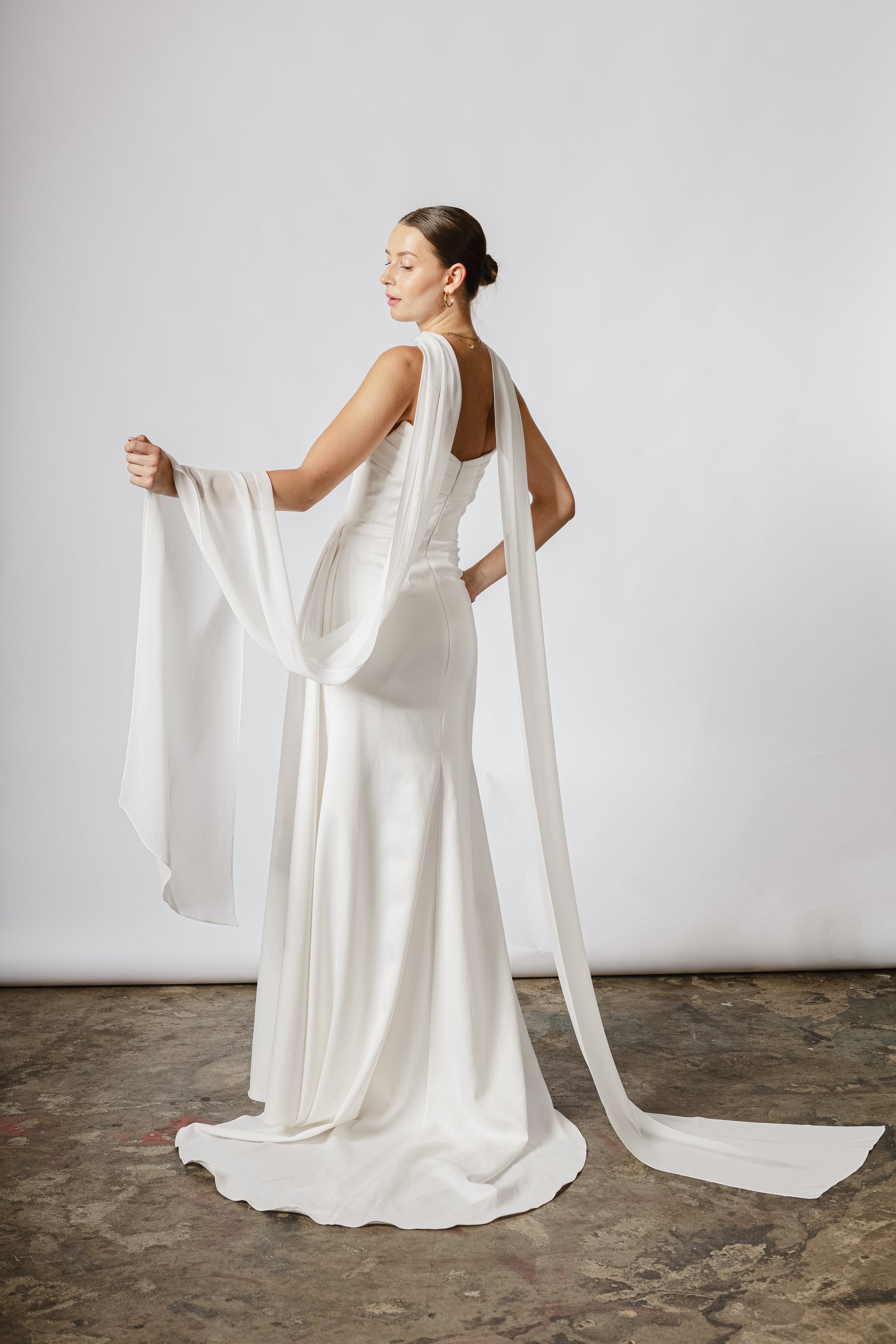 Lightweight bridal cape made of soft chiffon for an ethereal wedding look